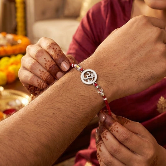Elegant Om Enamel Rakhi with Crystal Beads