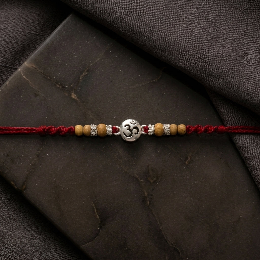 Elegant Silver-Tone 'Om' Rakhi