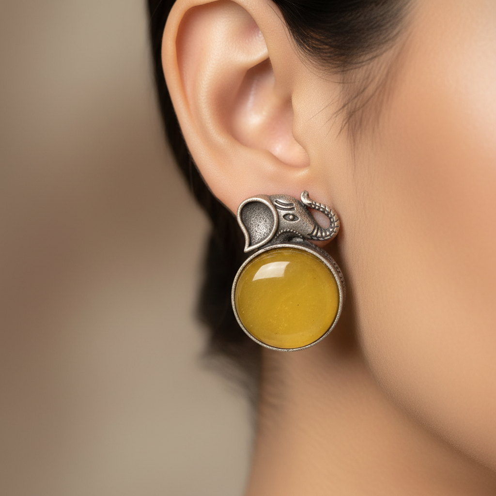 German Silver Elephant Stud Earrings with Yellow Stone