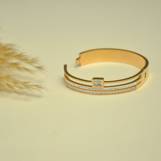 Elegant Dual-Tone Gold Bangle with Crystal Accent