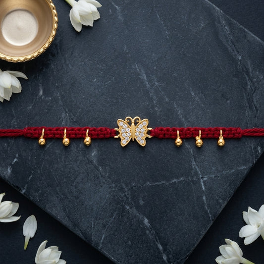 Sparkling Gold Butterfly Charm Rakhi on Red Macrame Thread