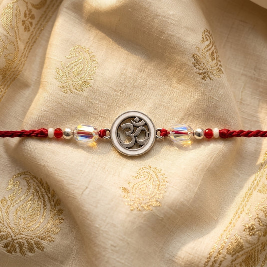 Elegant Om Enamel Rakhi with Crystal Beads