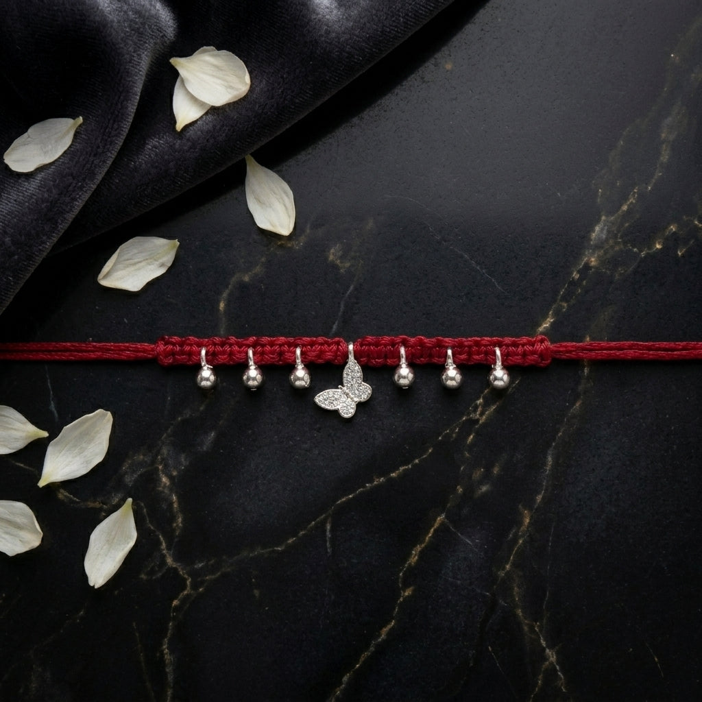 Elegant Silver Butterfly Charm Rakhi on Red Macrame Thread