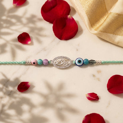 Sparkling Silver "Bro" Evil Eye Rakhi on Mint Thread
