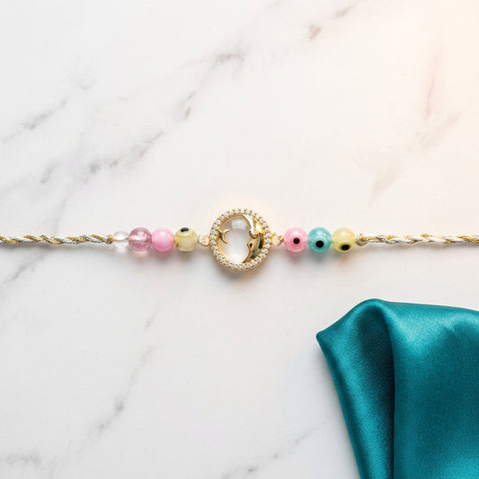 Celestial Moon and Star Evil Eye Rakhi with Pastel Beads