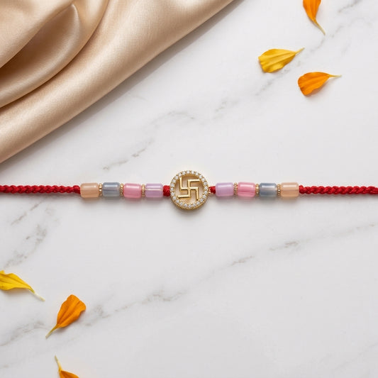 Auspicious Gold-Tone Swastik Rakhi with Pastel Beads
