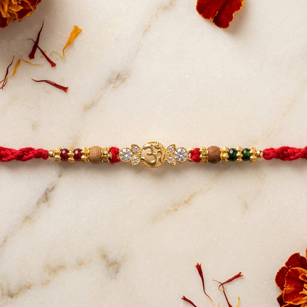 Asymmetric Gemstone Om Gold-Tone Rakhi